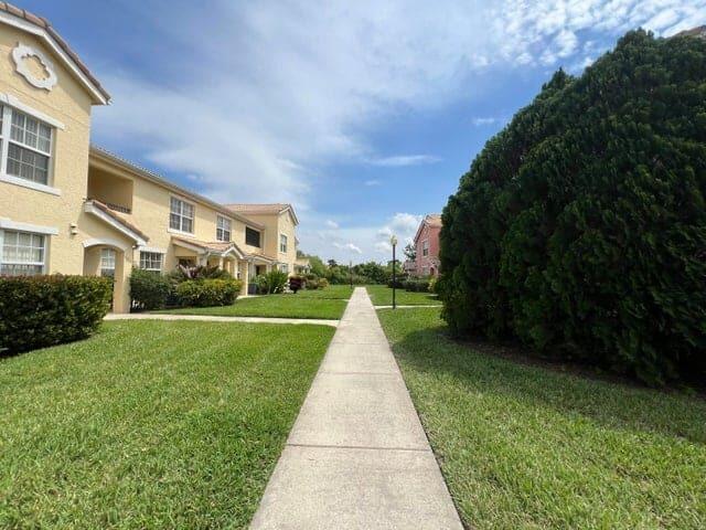 132 Southwest Peacock Boulevard, Unit 17104 Port St. Lucie, FL 34986 - Photo 26 of 28 a view of park with large trees