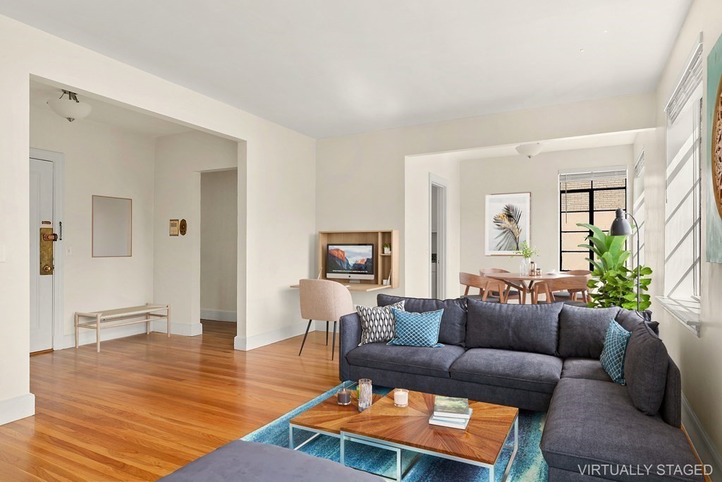 46 Chiswick Road, Unit 7 Boston, MA 02135 - Photo 2 of 16 a living room with furniture and a wooden floor