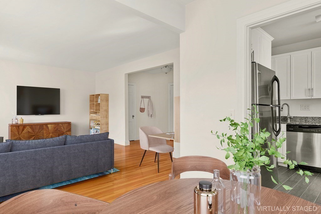 46 Chiswick Road, Unit 7 Boston, MA 02135 - Photo 3 of 16 a living room with furniture and a flat screen tv