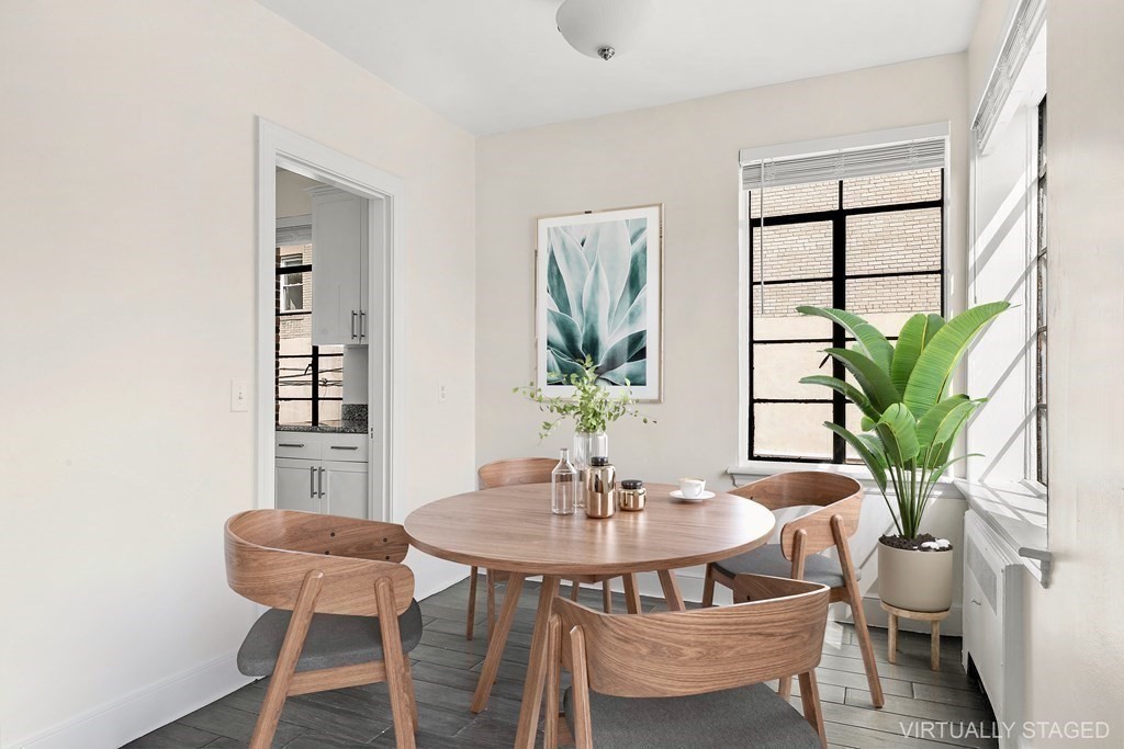 46 Chiswick Road, Unit 7 Boston, MA 02135 - Photo 4 of 16 a dining room with furniture and wooden floor