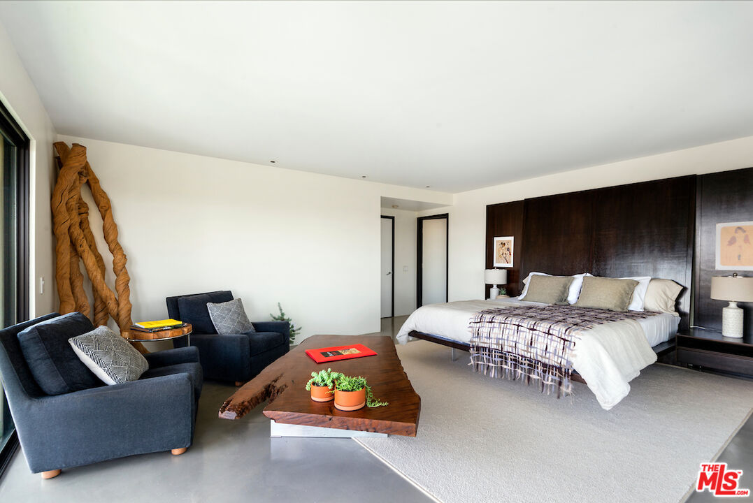 5668 Tryon Road Los Angeles, CA 90068 - Photo 15 of 21 a bedroom with bed couch and window