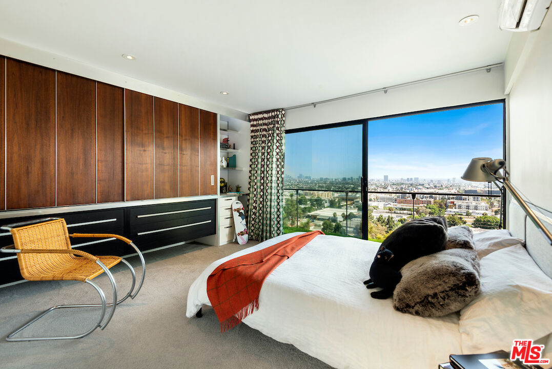5668 Tryon Road Los Angeles, CA 90068 - Photo 18 of 21 a bedroom with a bed and a window