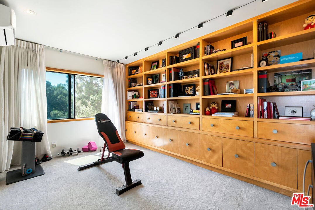 5668 Tryon Road Los Angeles, CA 90068 - Photo 19 of 21 a living room with furniture cabinets and flat screen tv