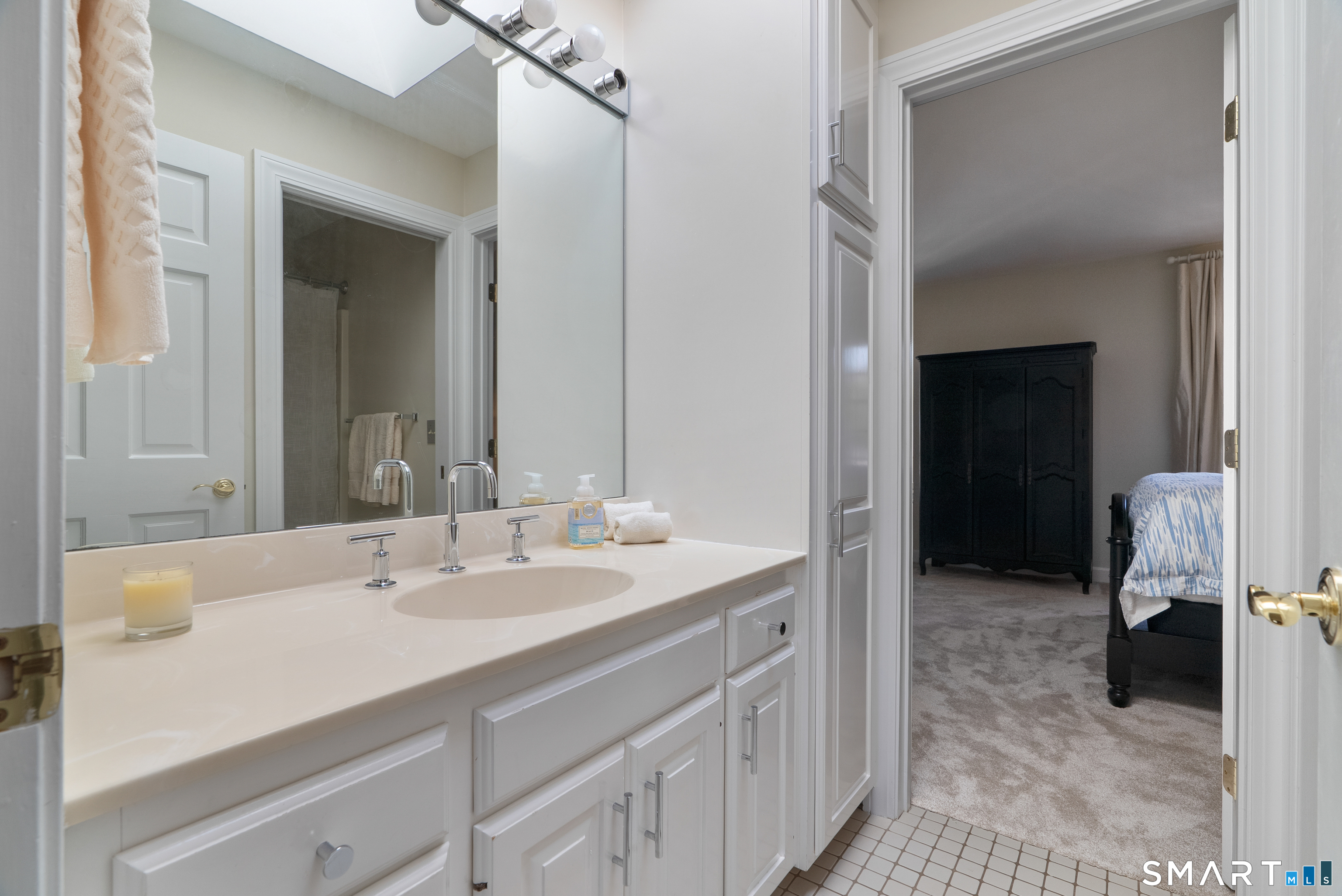 57 Thistledown Suffield, CT 06078 - Photo 23 of 39 a en suite bathroom with a sink and a mirror