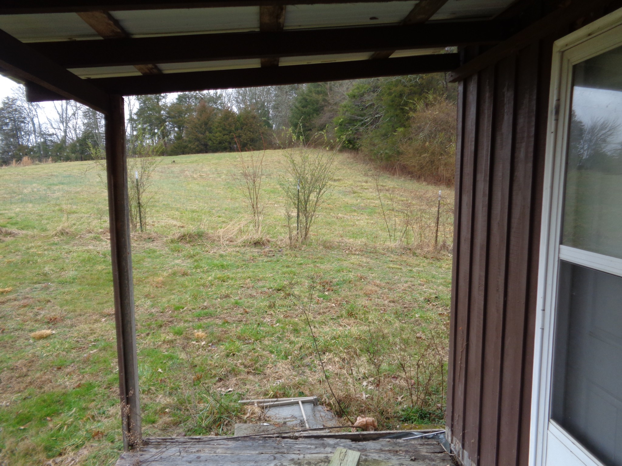 440 Stella Church Road Prospect, TN 38477 - Photo 6 of 18 a view of a glass door with a yard