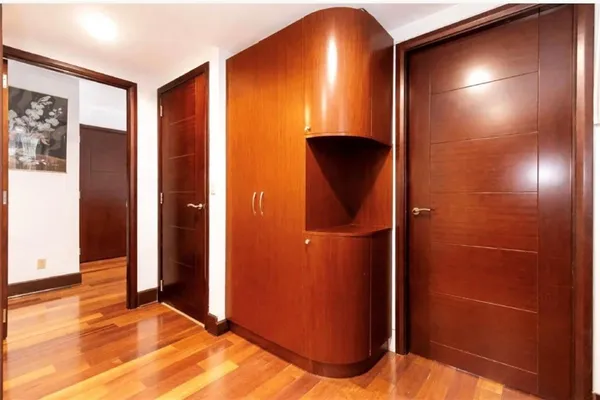 a view of front door with wooden floor and stairs