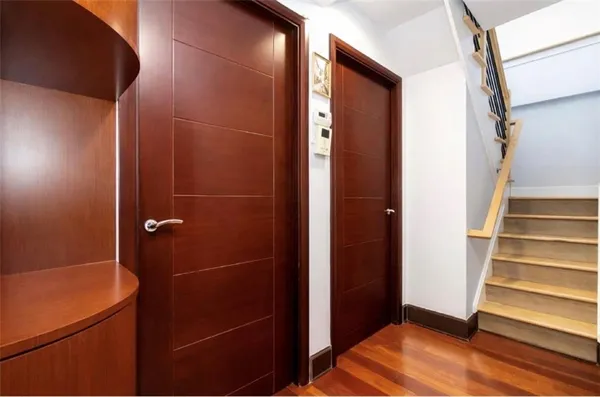 a view of gallery with wooden floor