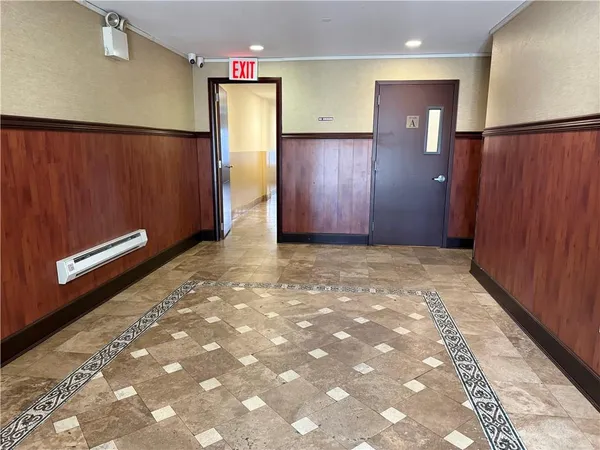 a view of workspace with furniture and window