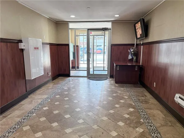 a view of a glass door and an entryway