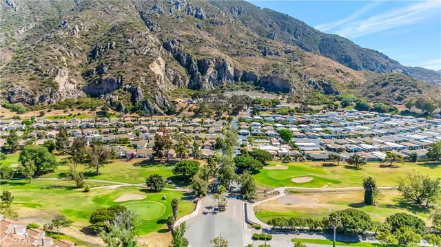 a swimming pool with outdoor seating and yard