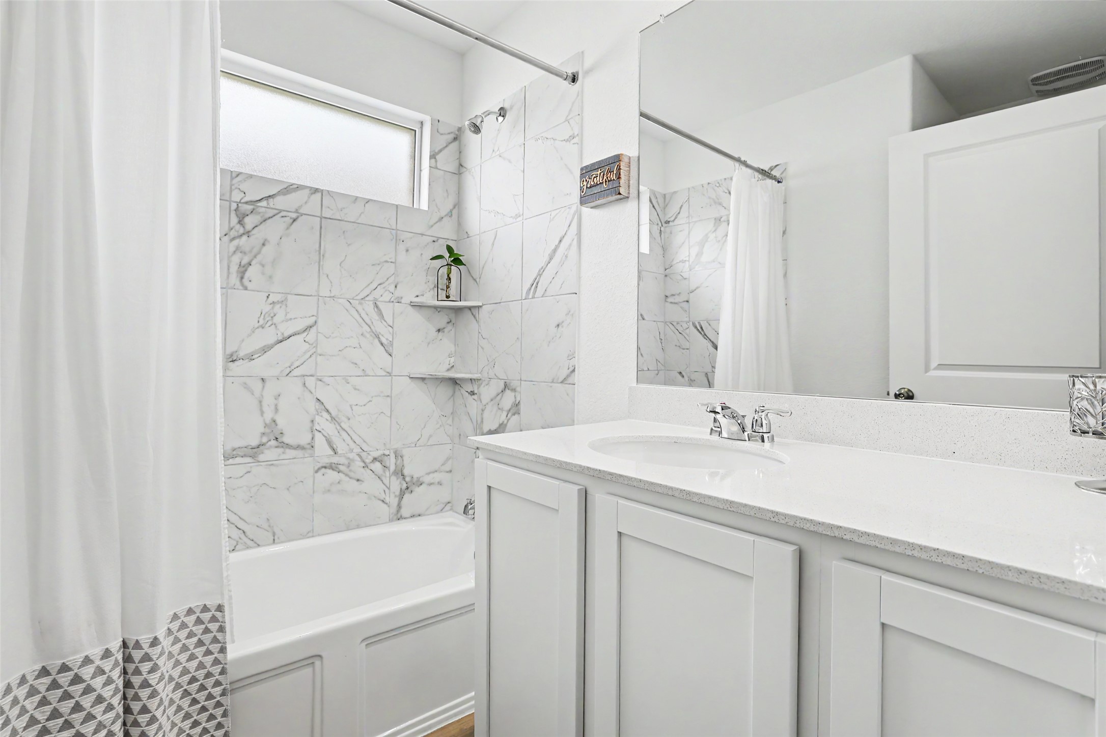 2333 Four Waters Loop Georgetown, TX 78628 - Photo 29 of 35 Bathroom featuring a white vanity with an integrated sink and light-colored countertop