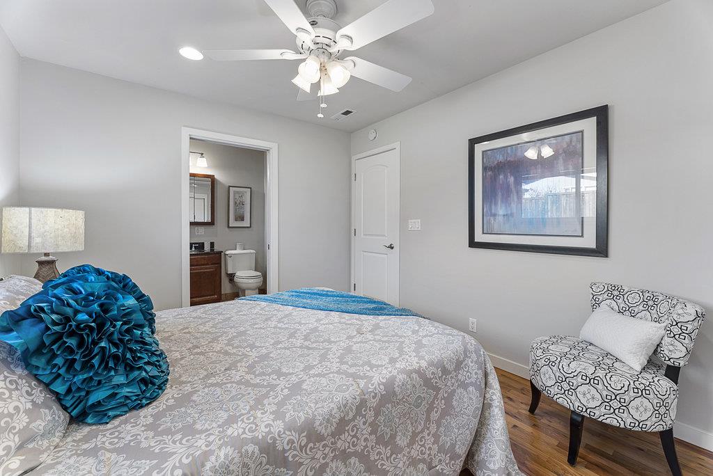 213 Siesta Drive Aptos, CA 95003 - Photo 20 of 33 a bedroom with a bed and a chandelier