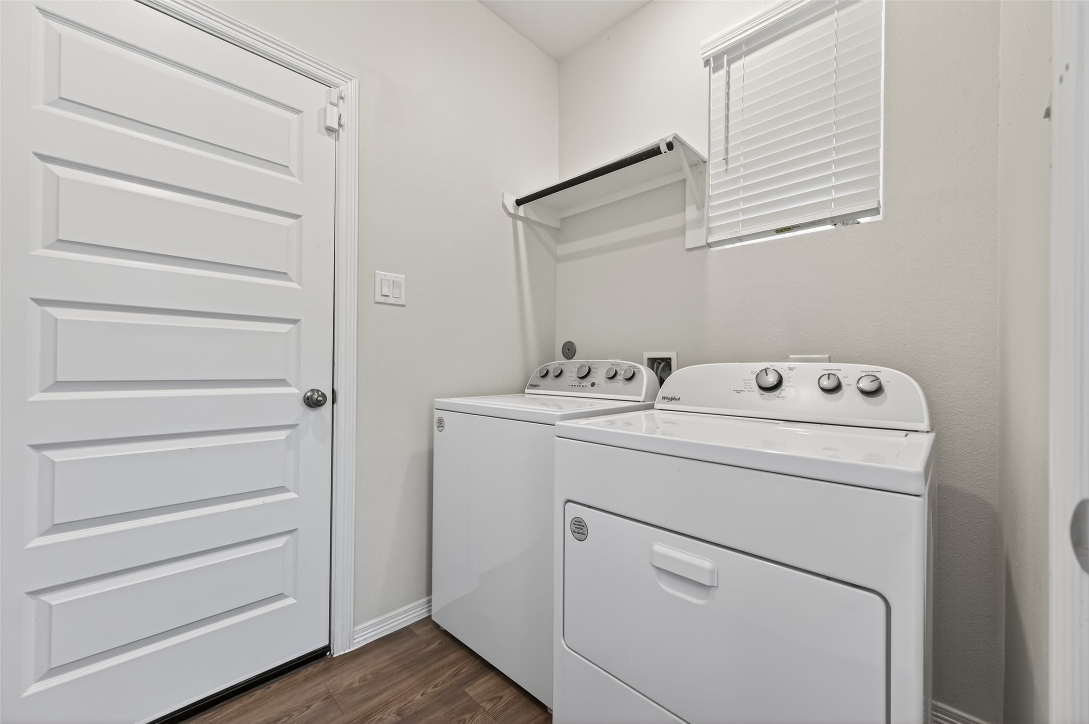 23222 Spring Genesis Lane Katy, TX 77493 - Photo 21 of 43 A convenient utility room with washer and dryer connections, providing easy access to the garage.