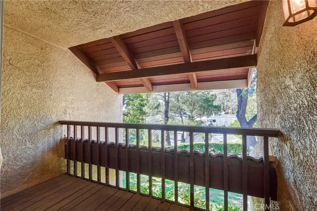 a view of porch with wooden floor