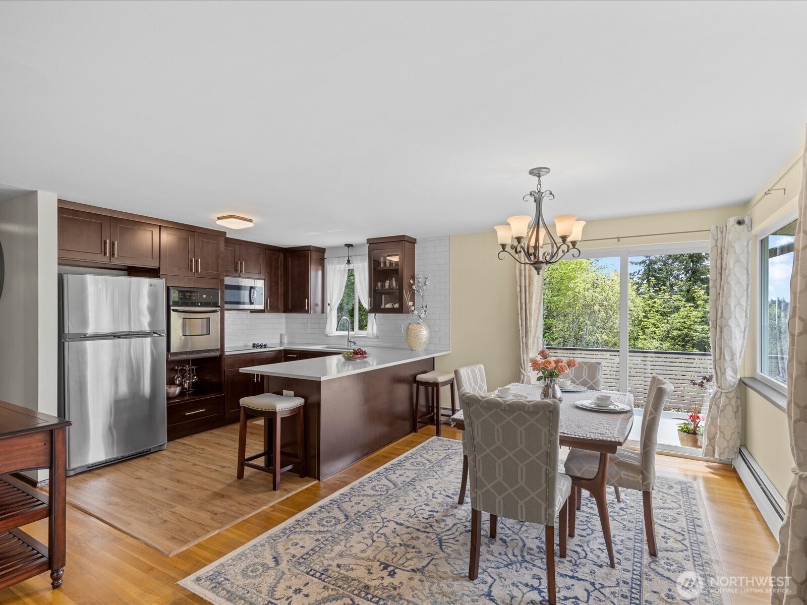 1401 Southwest 137th Street Burien, WA 98166 - Photo 14 of 40 a view of a dining room with furniture window and wooden floor