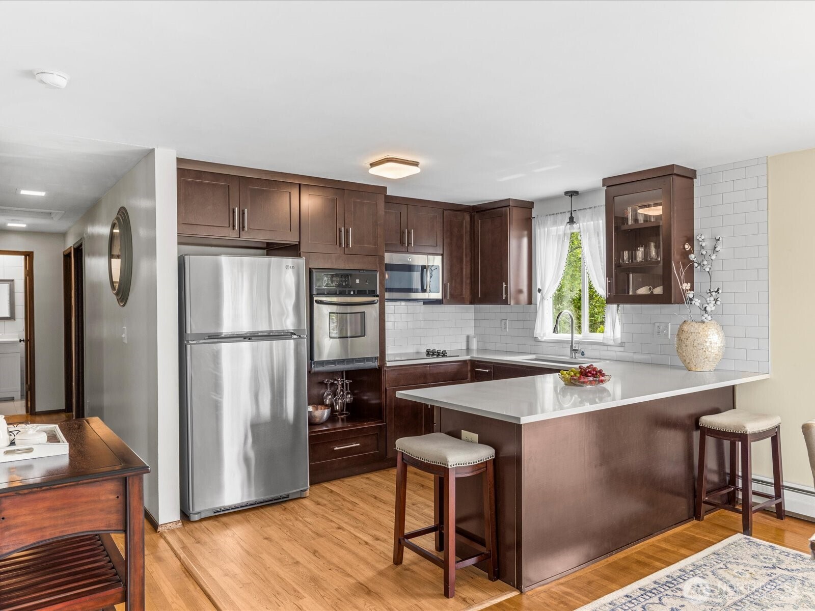 1401 Southwest 137th Street Burien, WA 98166 - Photo 15 of 40 a kitchen with stainless steel appliances granite countertop a sink refrigerator and microwave