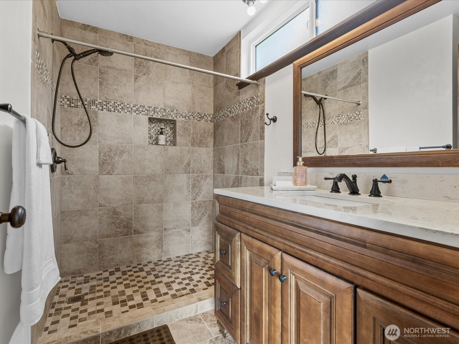 1401 Southwest 137th Street Burien, WA 98166 - Photo 22 of 40 a bathroom with a granite countertop sink a shower and a mirror