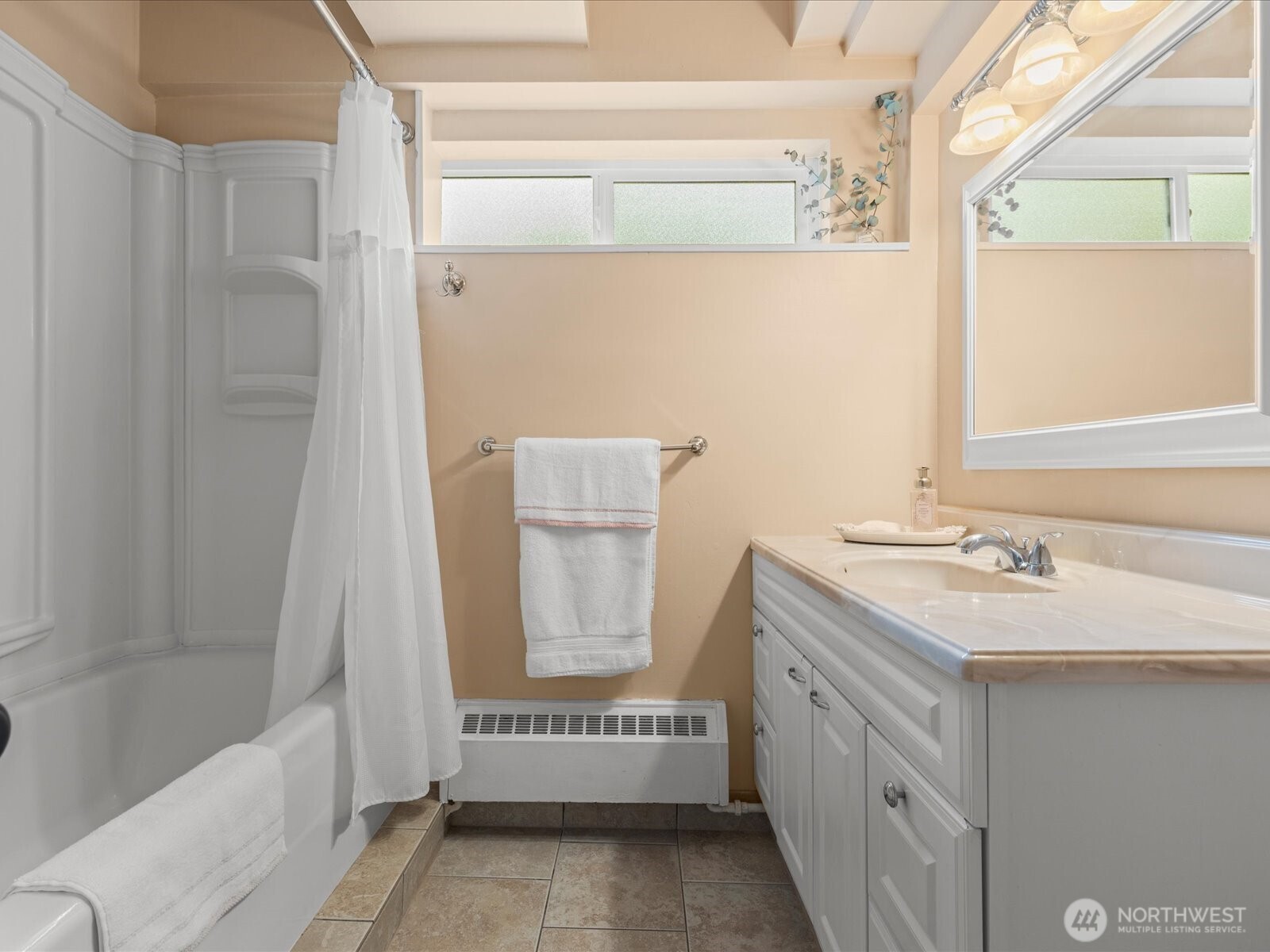 1401 Southwest 137th Street Burien, WA 98166 - Photo 34 of 40 a bathroom with a sink and a mirror