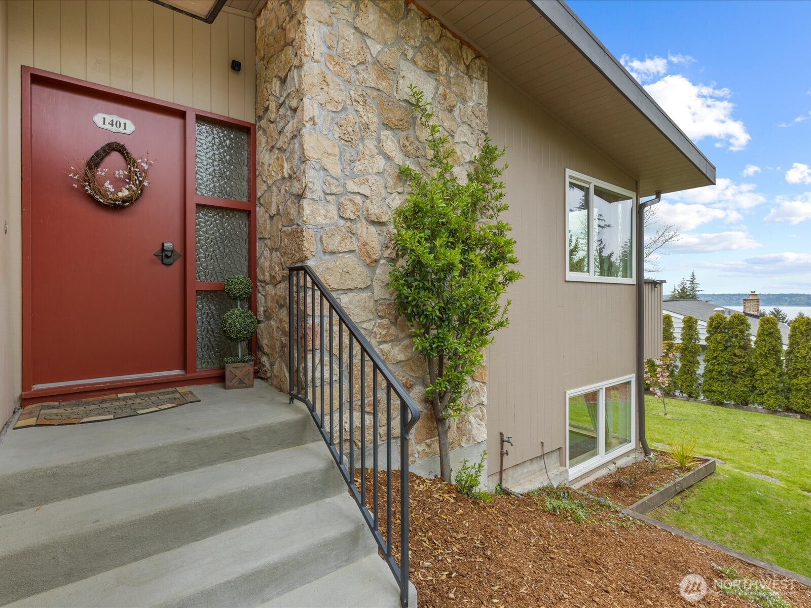 1401 Southwest 137th Street Burien, WA 98166 - Photo 6 of 40 a view of a house with backyard and trees