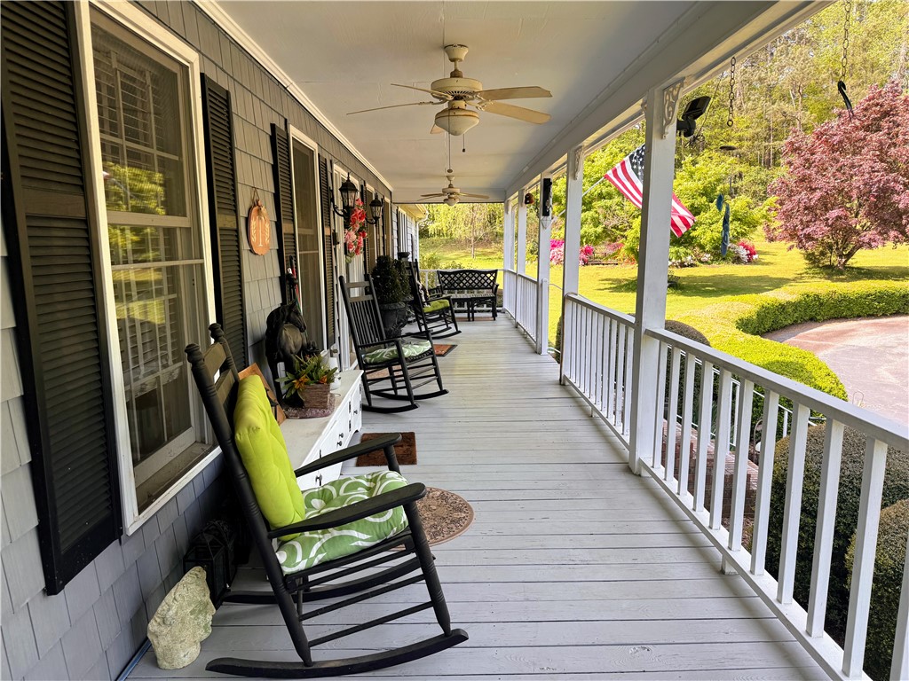 208 Knoxwood Court Anderson, SC 29621 - Photo 11 of 38 Relax on this charming front porch, offering peaceful views of the expansive yard.