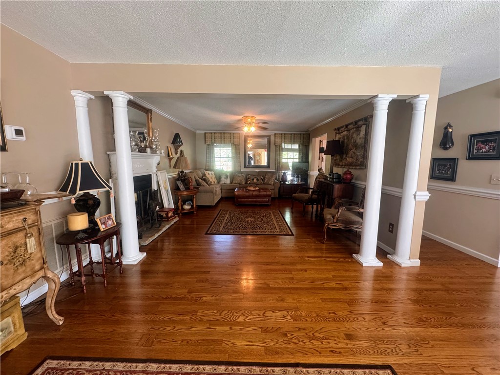 208 Knoxwood Court Anderson, SC 29621 - Photo 13 of 38 This inviting living space features gleaming hardwood floors and a cozy fireplace.