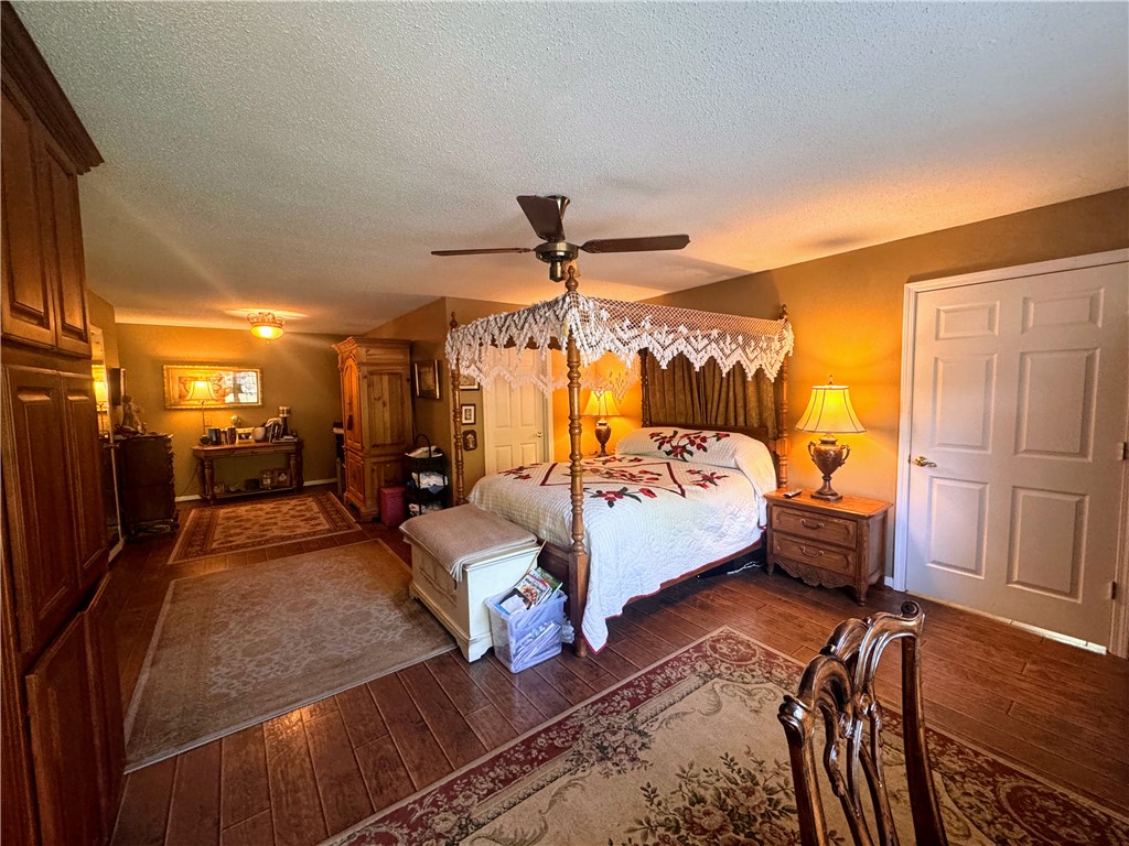 208 Knoxwood Court Anderson, SC 29621 - Photo 18 of 38 This spacious bedroom features warm wood flooring, offering a comfortable and inviting atmosphere.