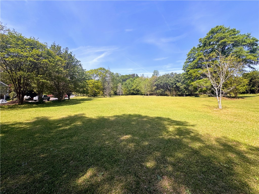 208 Knoxwood Court Anderson, SC 29621 - Photo 36 of 38 Expansive green yard with mature trees offers a serene natural setting.