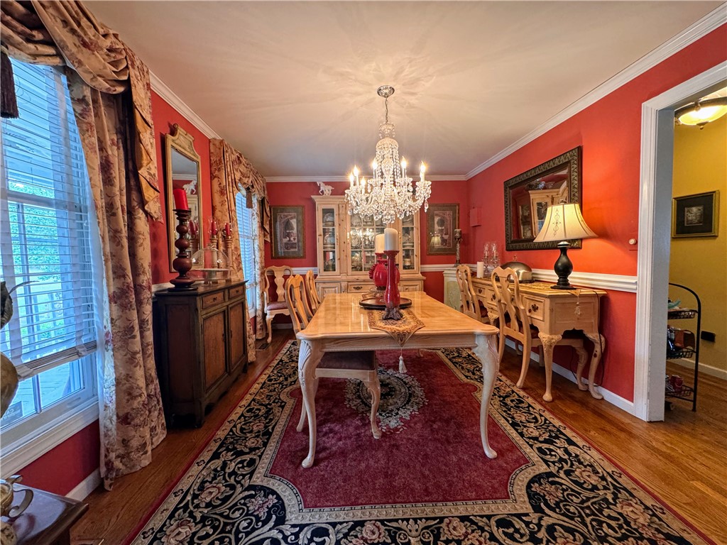 208 Knoxwood Court Anderson, SC 29621 - Photo 5 of 38 This formal dining room offers a refined space for memorable gatherings and sophisticated meals.