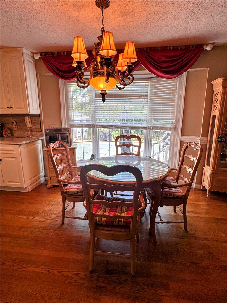 208 Knoxwood Court Anderson, SC 29621 - Photo 8 of 38 This inviting dining area features a warm ambiance, perfect for intimate meals and gatherings.