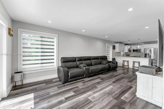 a living room with furniture and a window