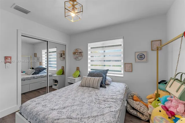 a bedroom with a bed and furniture