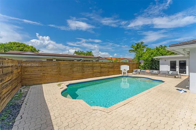 a view of a swimming pool with a lounge chairs