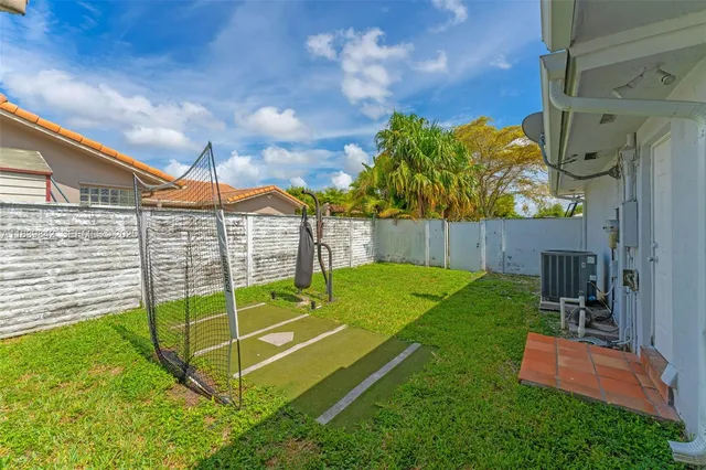a view of a backyard with a garden and stairs