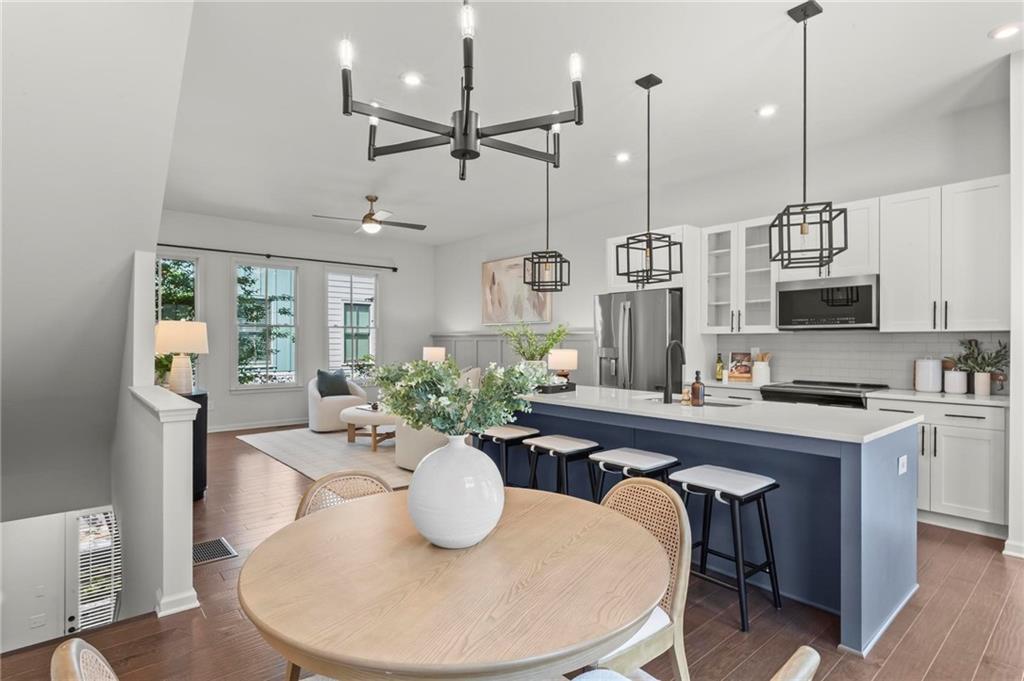 718 Needletail Way Atlanta, GA 30312 - Photo 5 of 44 a dining room with furniture and wooden floor