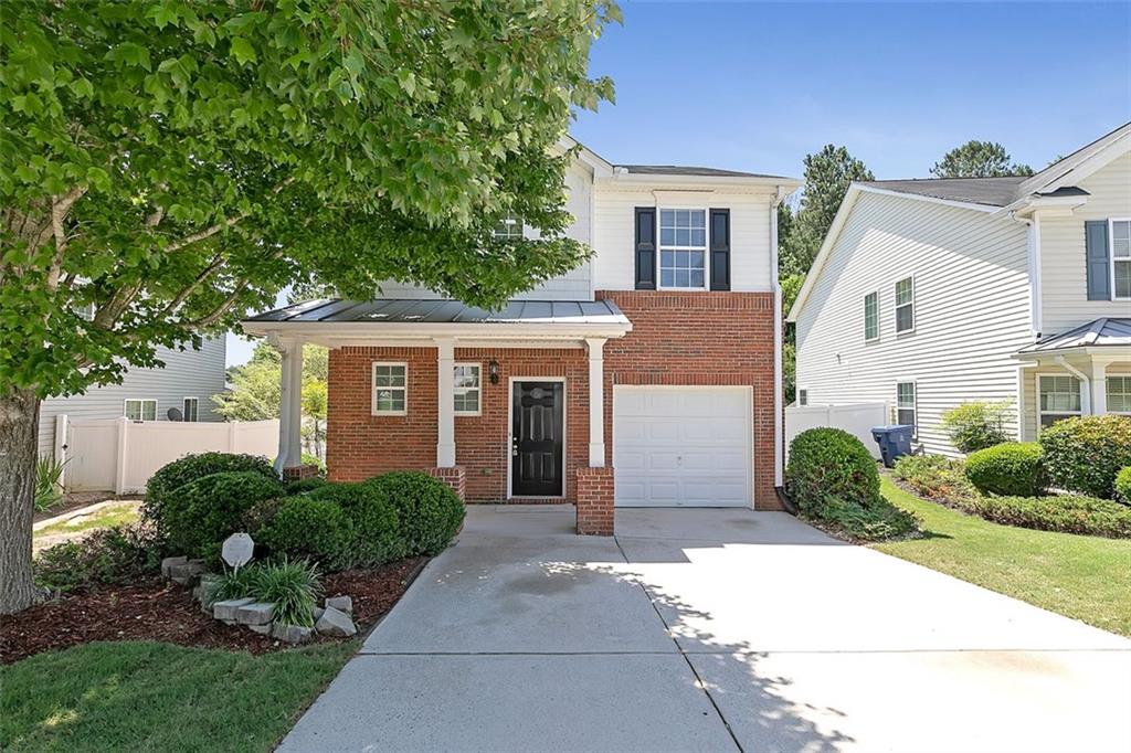103 Silver Spring Street Dallas, GA 30157 - Photo 1 of 1 a front view of a house with garden