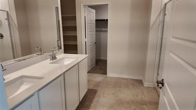 a bathroom with a sink a vanity and a mirror
