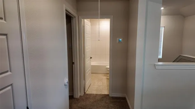 a view of a bathroom with mirror