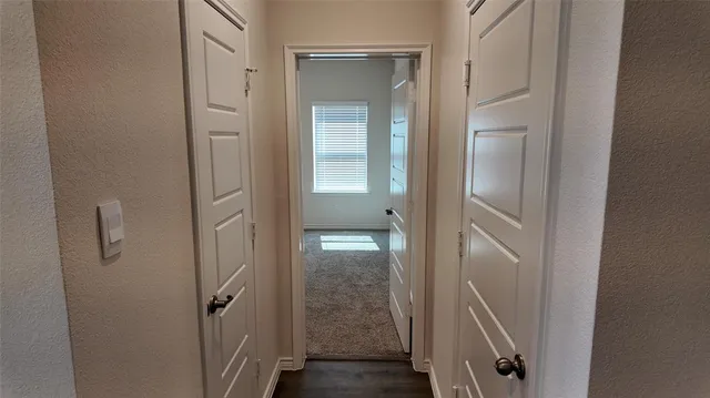 a bathroom with a glass door shower and sink