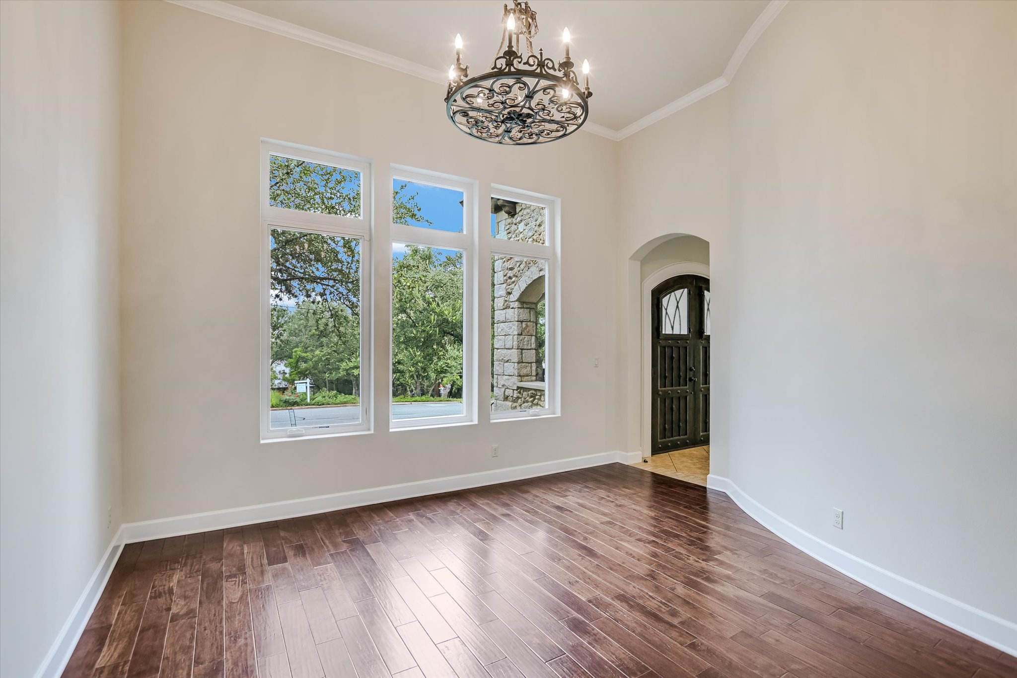11 Inwood Circle Austin, TX 78746 - Photo 7 of 38 Ornate chandelier and a rich wood floor create an inviting entry space.