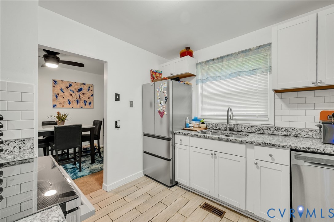2909 Springview Drive Richmond, VA 23234 - Photo 11 of 19 a kitchen with a sink and cabinets