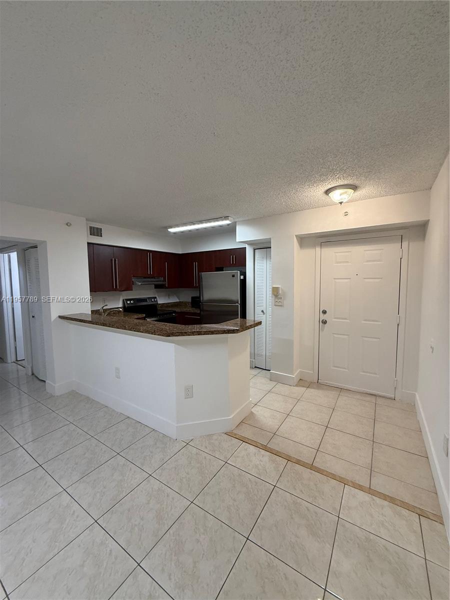761 North Pine Island Road, Unit 104 Plantation, FL 33324 - Photo 18 of 26 a view of kitchen with white cabinets