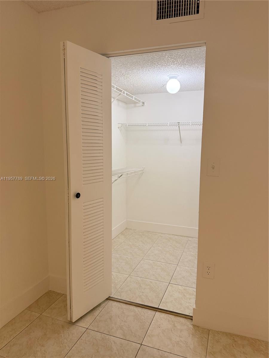 761 North Pine Island Road, Unit 104 Plantation, FL 33324 - Photo 22 of 26 a view of a small space with wooden floor