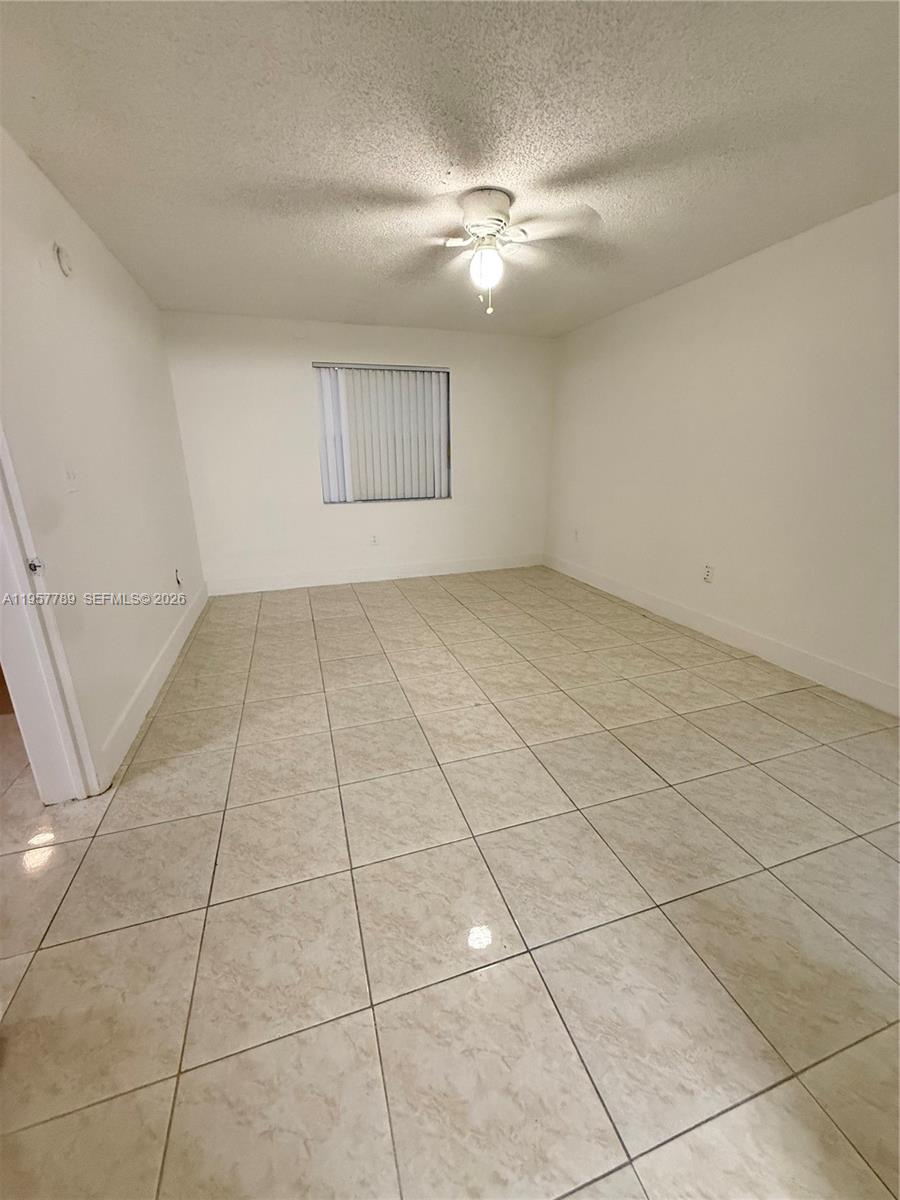 761 North Pine Island Road, Unit 104 Plantation, FL 33324 - Photo 23 of 26 a view of an empty room with a window