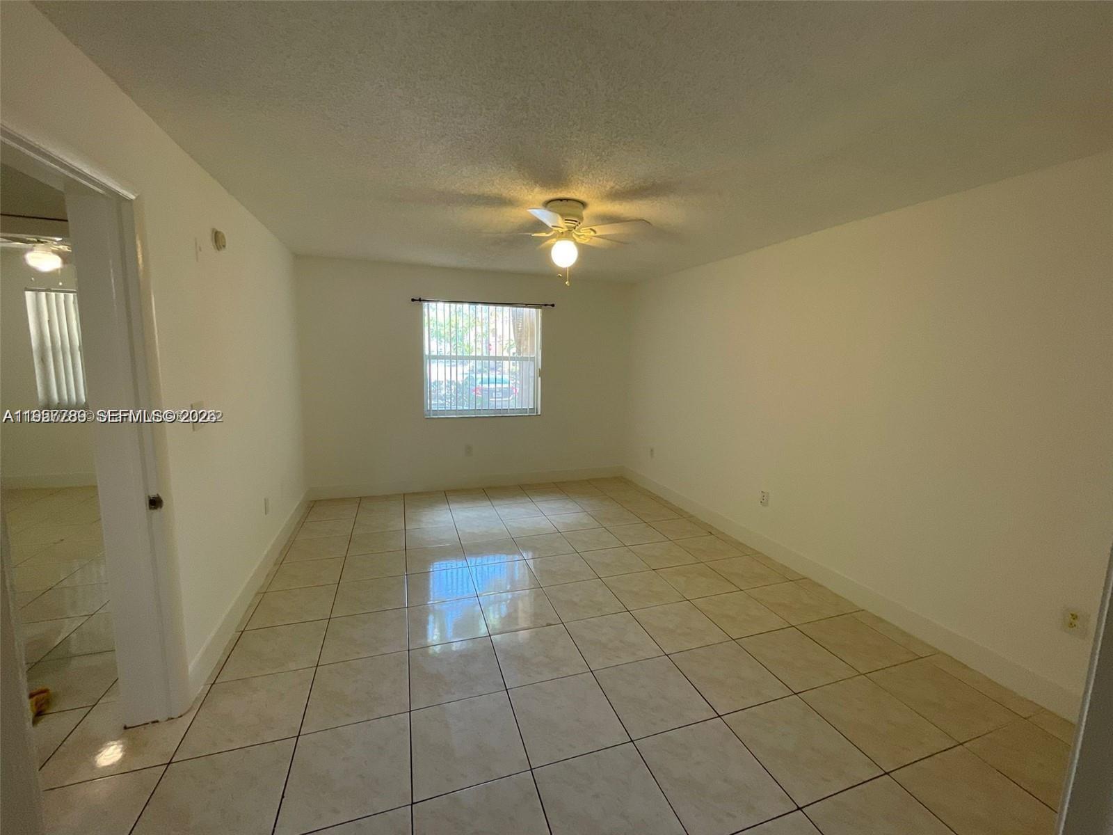 761 North Pine Island Road, Unit 104 Plantation, FL 33324 - Photo 8 of 15 a view of empty room with windows