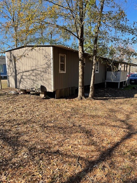 2264 County Road 3405 Cleveland, TX 77327 - Photo 6 of 10 a backyard of a house with lots of green space