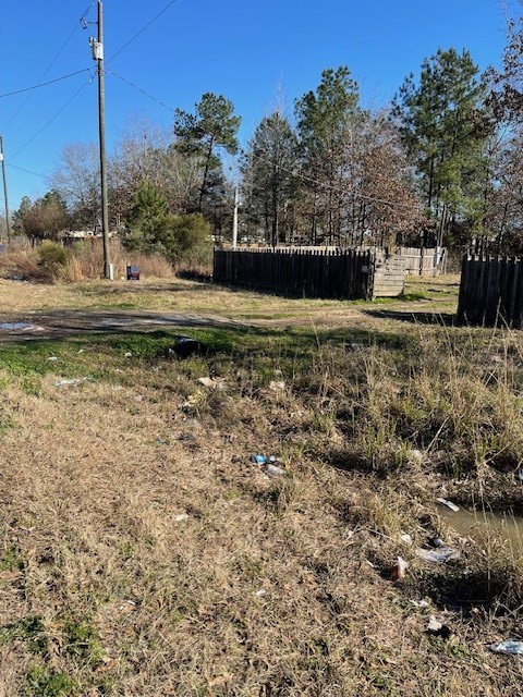 2264 County Road 3405 Cleveland, TX 77327 - Photo 8 of 10 a view of a yard with a tree
