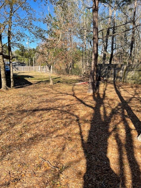 2264 County Road 3405 Cleveland, TX 77327 - Photo 9 of 10 a view of yard with tree