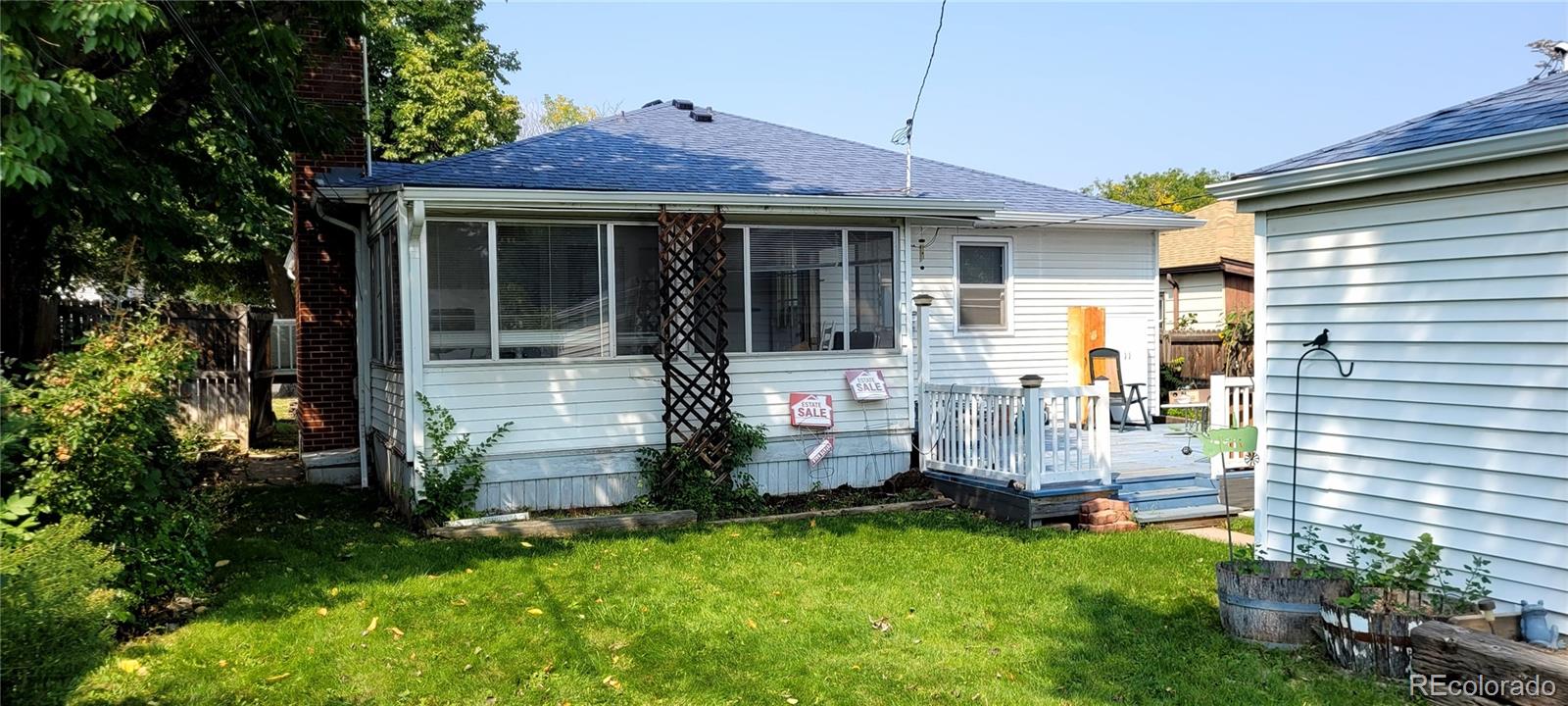 3450 Benton Street Wheat Ridge, CO 80212 - Photo 11 of 20 front view of a house with a yard