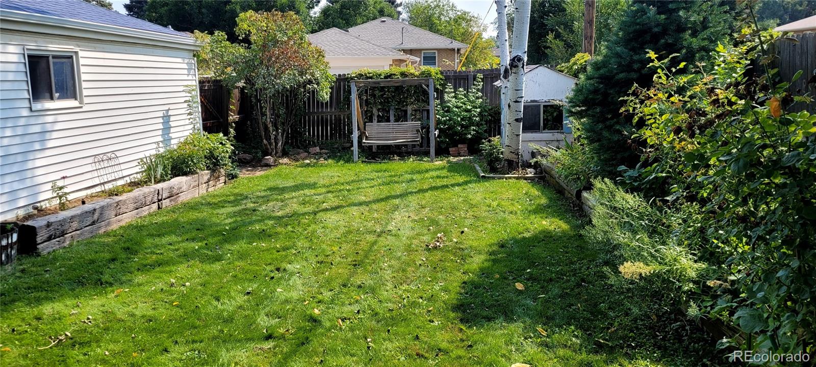3450 Benton Street Wheat Ridge, CO 80212 - Photo 12 of 20 a view of a garden in front of house