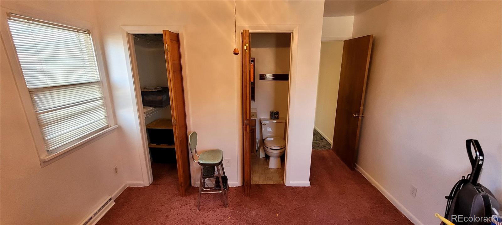 3450 Benton Street Wheat Ridge, CO 80212 - Photo 13 of 20 a view of a bathroom with a sink and a mirror